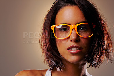 Buy stock photo Portrait, beauty and woman with glasses in studio for vision isolated on a brown background mockup space. Face, eyewear and fashion of young model in spectacles with makeup or cosmetics in Germany