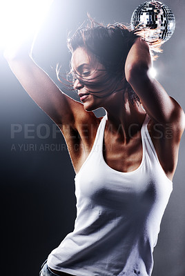 Buy stock photo Cropped shot of an attractive young woman dancing with total freedom