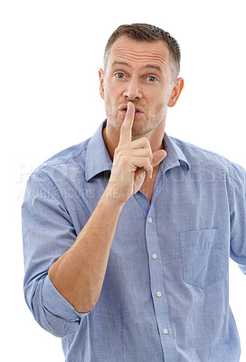 Buy stock photo Hush, secret and portrait of a man in a studio with a silence, quiet or whisper face expression. Person, handsome and mature male model with a finger on his mouth gesture isolated by white background