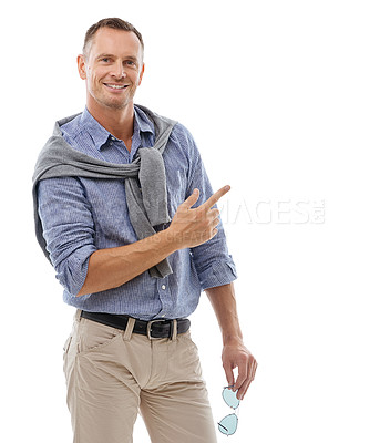 Buy stock photo Man, portrait and pointing for product placement standing isolated against a white studio background. Happy male with smile showing gesture or pointed finger in presenting for advertisement on mockup