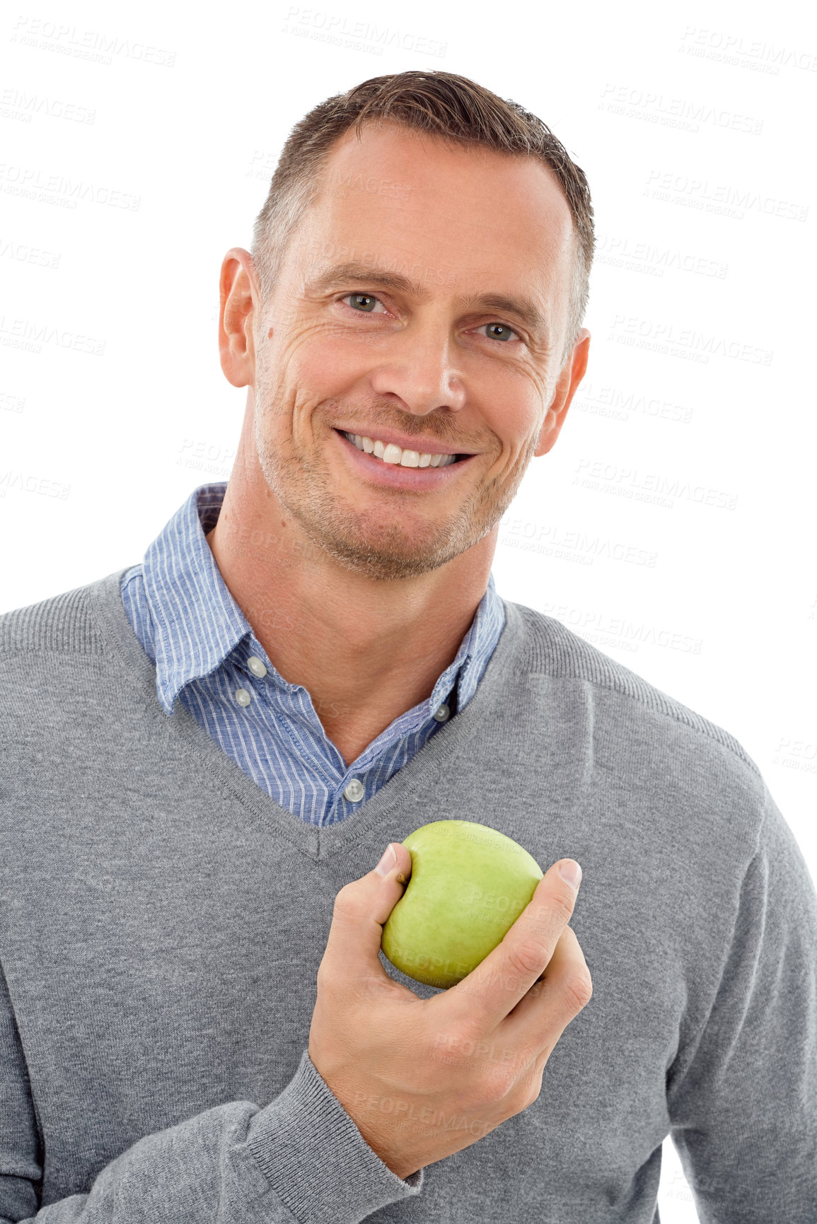 Buy stock photo Man, happy studio portrait and apple fruit for health, diet and wellness isolated on a white background. Model person with nutrition vegan food for a healthy lifestyle, motivation and clean eating