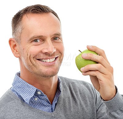 Buy stock photo Man, apple and happy studio portrait with fruit for health, diet and wellness isolated on a white background. Model person smile for vegan nutrition food for healthy lifestyle, motivation and eating
