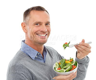 Buy stock photo Portrait, food and salad with a man in studio isolated on a white background eating vegetables for health. Green, nutrition or diet with a happy mature male indoor to eat an organic meal for wellness