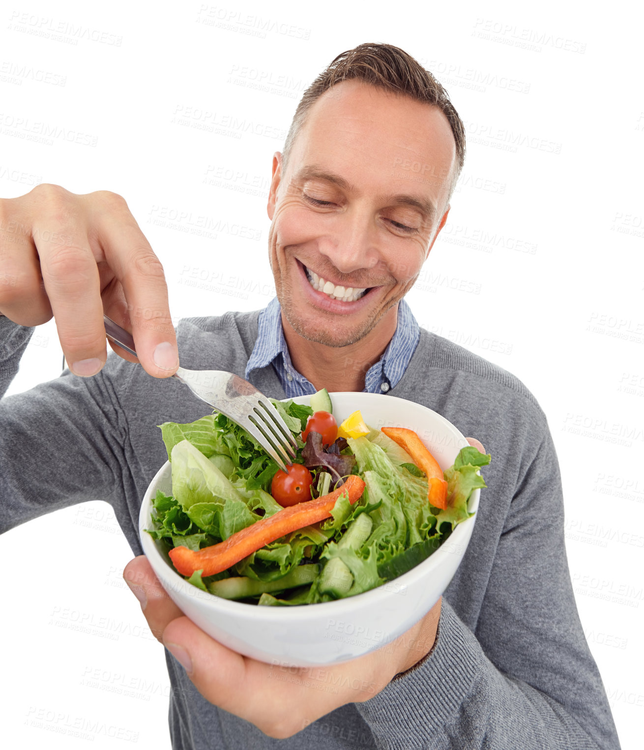 Buy stock photo Salad, healthy eating and diet of a man in studio with vegetable food with nutrition for health. Happy model person with vegan lunch or brunch isolated on a white background with a fork for wellness