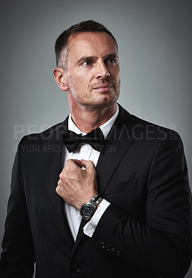 Buy stock photo Fashion, success and mature man in tuxedo, handsome online dating profile picture isolated on grey background in studio. Luxury, rich elegant celebrity actor style and date for valentines day.