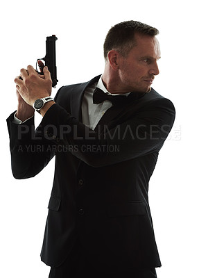 Buy stock photo Movie star, gun and spy agent man with isolated, white background and mockup ready for action. Actor, weapon and tuxedo suit of a man looking mysterious with classy style and pistol for danger
