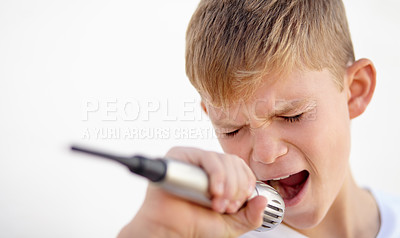 Buy stock photo Microphone, singer and creative talent of kid in studio isolated on a white background. Child on mic, karaoke and music, play and recording voice, sound or audio performance of musician on technology
