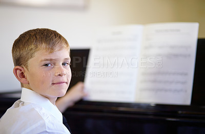 Buy stock photo Boy, portrait or piano music or sheet note skill practice, hobby development or talent class. Male person, child and face or key instrument notebook for learning performance, education or show lesson