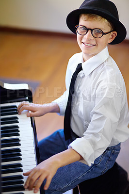 Buy stock photo Child, piano and smile for music, learning and confident with attention, musician and enjoy. Portrait, creative and passion with maestro, play and happy for musical, boy and practice concentration
