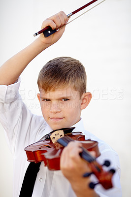 Buy stock photo Boy, portrait or violin bow practice for music lesson, musician talent or learning skill. Male person, school child or white background for instrument hobby education or concert, audio or listening