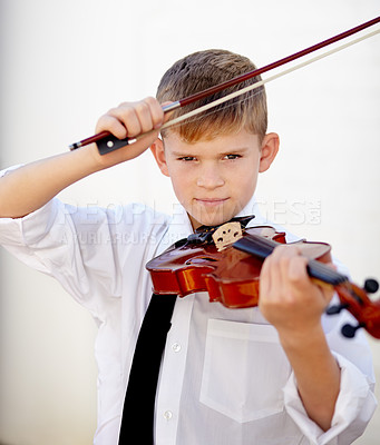 Buy stock photo Boy, portrait or violin bow for music practice, talent development or learning skill lesson. Male person, school child or white background or string instrument hobby concert, orchestra or listening