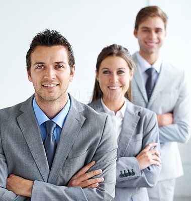 Buy stock photo Businessman, portrait and leader with team, arms crossed and happy for future in finance career. Colleagues, accountants in suit and professional in workplace, people in background and confident
