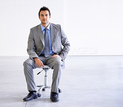 Buy stock photo Portrait, serious and business man on chair in office, workplace or corporate company on mockup space. Confident professional, employee and worker, lawyer and attorney in suit for career in Spain