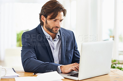 Buy stock photo Laptop, internet and report with business man at desk in office, working on corporate review or feedback. Computer, email or website with confident young employee typing information in workplace