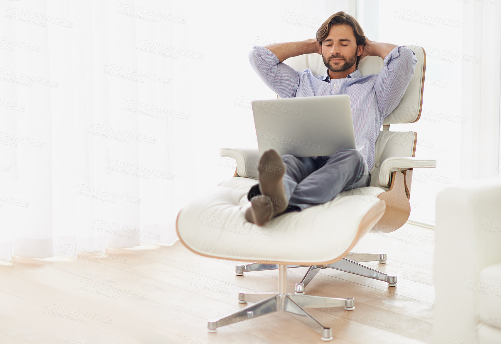 Buy stock photo Businessman, relax and sofa with computer online for remote work, living room and home office for freelance job. Male person, social media and browsing or research on laptop, couch and smile