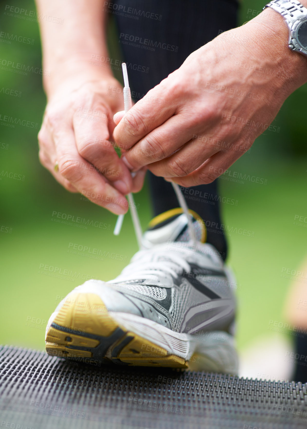 Buy stock photo Hands, tie or runner with shoes in nature for exercise, training or outdoor fitness workout. Start, man or closeup of legs of athlete in park with sports footwear ready for jog, walking or wellness