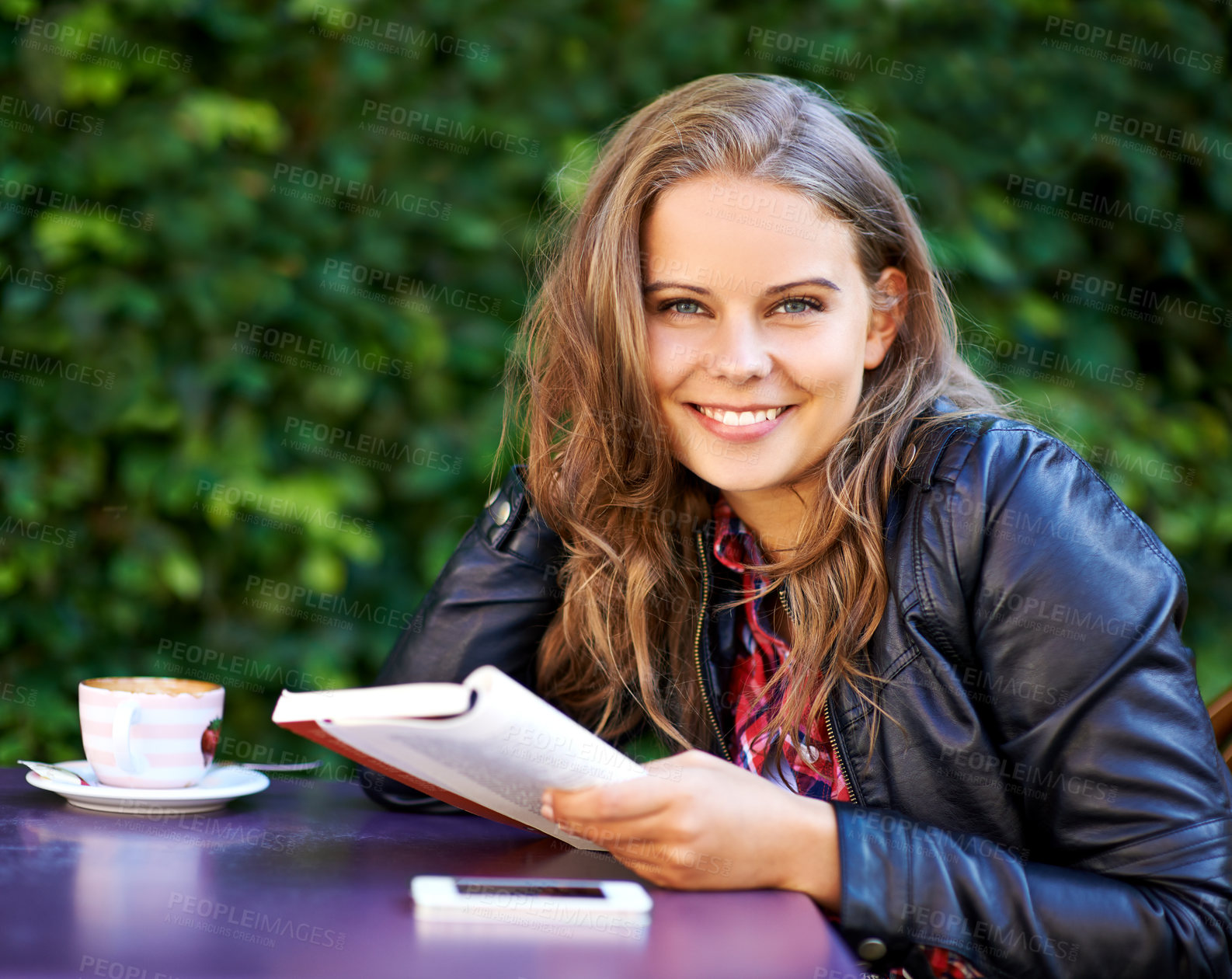 Buy stock photo College student, portrait and reading a book at coffee shop on university, campus or restaurant. Happy, woman and learning from studying books, textbook or relax with  knowledge at outdoor cafe