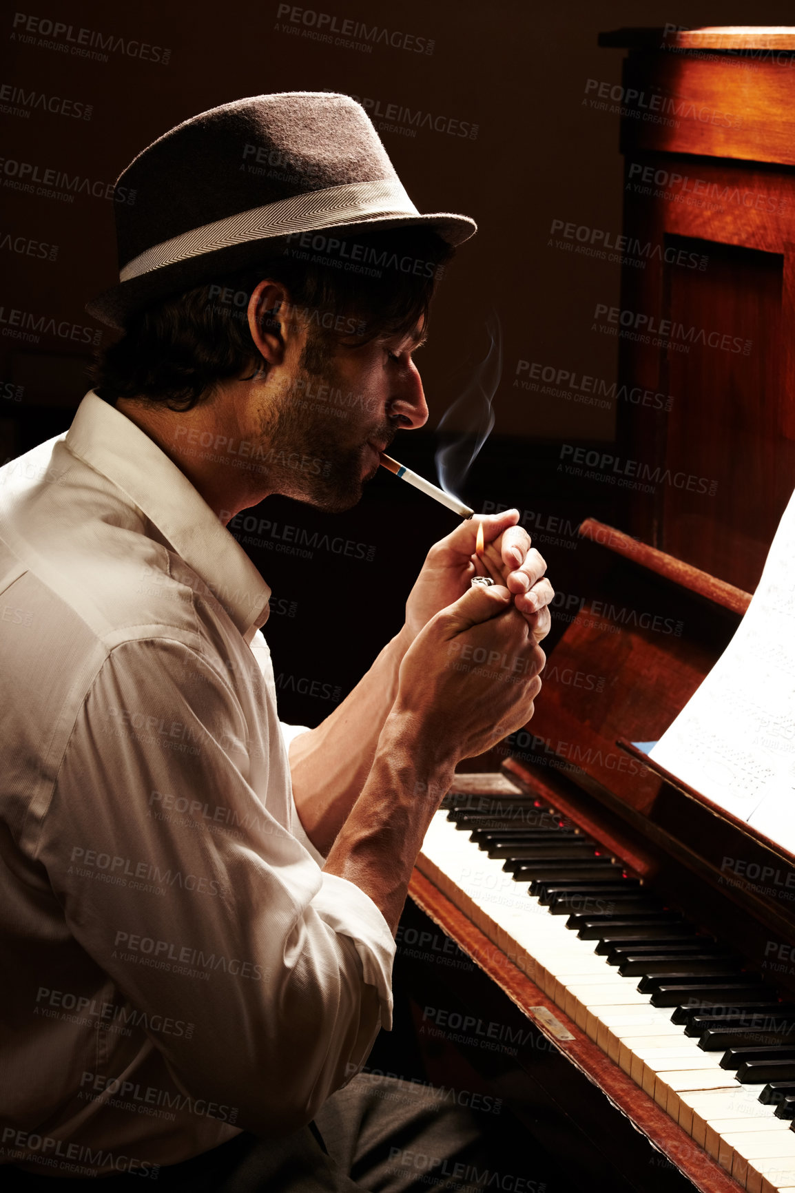 Buy stock photo Creative, smoking and man with a piano, musician and practice with entertainment, performance and profile. Artistic, smoker and sound with instrument, tobacco and cigarette with music and jazz