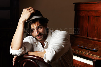 Buy stock photo Portrait, musician and man with a piano, creative and fashion with confidence, hat and performer. Face, person and pianist with instrument, stylish outfit and clothes with jazz, smile and performance