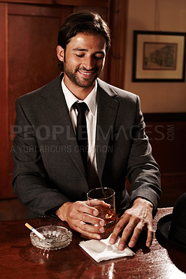 Buy stock photo Pub, thinking and man with whiskey, fashion and smile with gentleman, success and relax with cigarette. Person, entrepreneur and guy with alcohol, suit and formal with happiness, tavern and tobacco