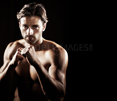 Buy stock photo Portrait, body of man and fist of boxer in studio isolated on black background mockup space. Serious face, boxing and muscle of topless athlete ready for fight, exercise or training, sport or fitness