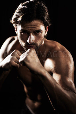 Buy stock photo Portrait, body of man and fist of boxer in studio isolated on black background. Serious face, boxing or muscle of topless athlete ready to fight, exercise or training, combat sport or fitness workout