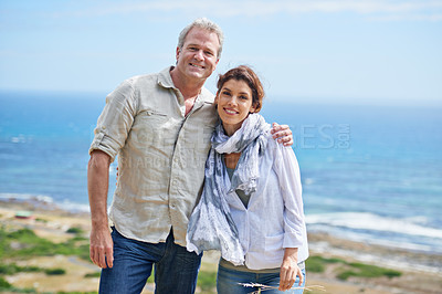Buy stock photo Mature, couple and happy portrait together at sea, ocean or hug on the beach outdoor. Summer, vacation or holiday with old man and woman in embrace with love, trust and support in marriage and nature