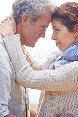 Buy stock photo Couple, face and smile outdoor with hug for romance, love and relationship in nature with date. Mature, man and woman or embrace with happy, marriage and joyful for bonding, honeymoon and support 