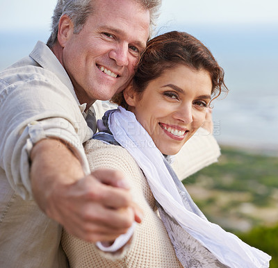 Buy stock photo Mature couple, portrait and outdoor on vacation, airplane hands and happiness for holiday. Man, woman and bonding together with smile, marriage and commitment with affection, seaside and joyful