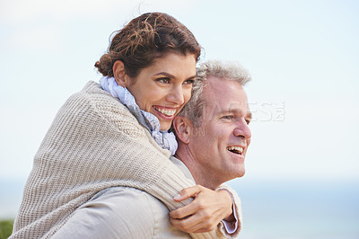 Buy stock photo Mature couple, happy and piggy back on vacation, love and affection for holiday fun. Man, woman and bonding together with smile, marriage and commitment for travelling, care and relationship
