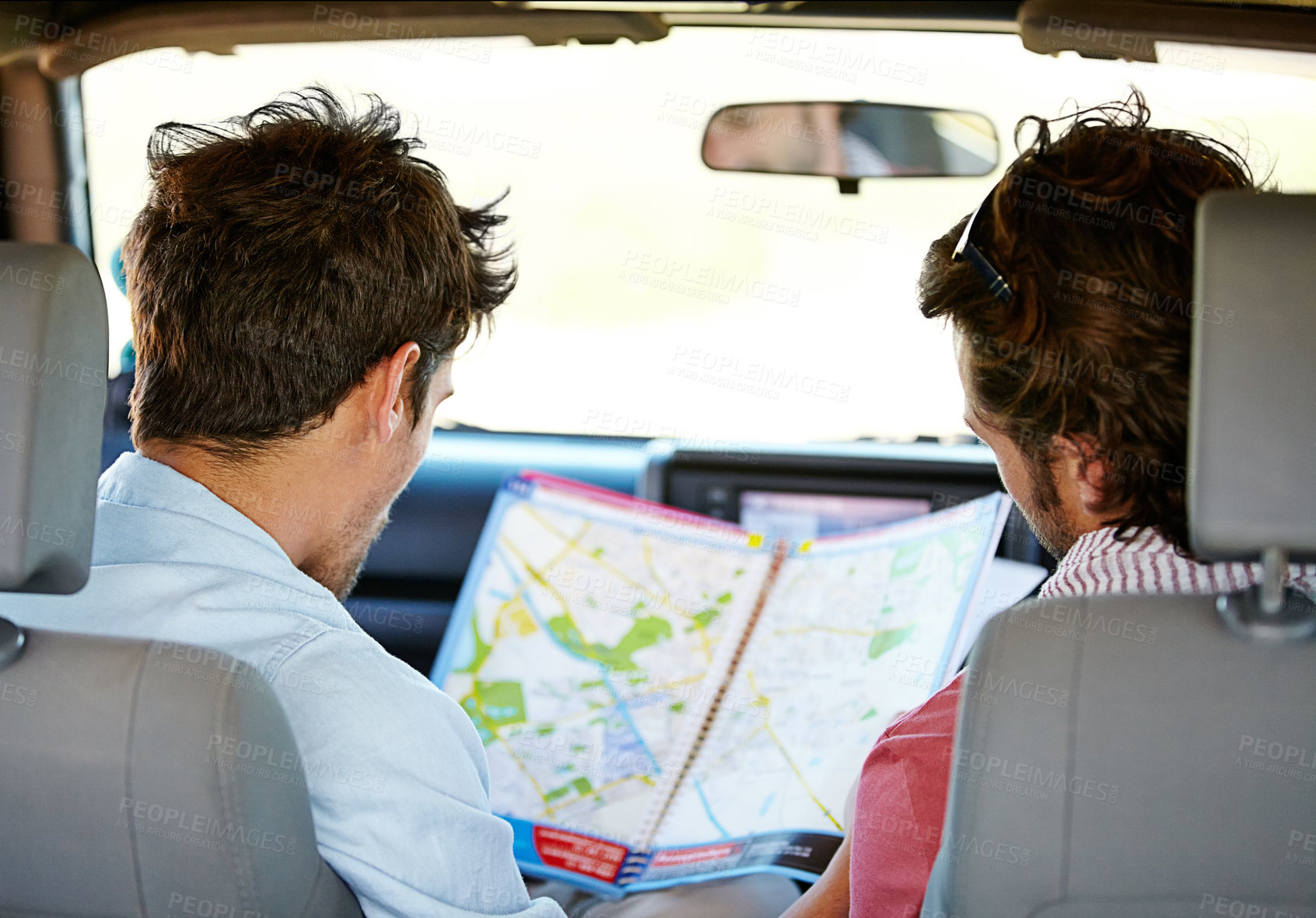 Buy stock photo Road trip, map and people for travel adventure, journey and holiday with tourism guide, check and planning. Driver, men or young friends with location search, direction and destination from behind