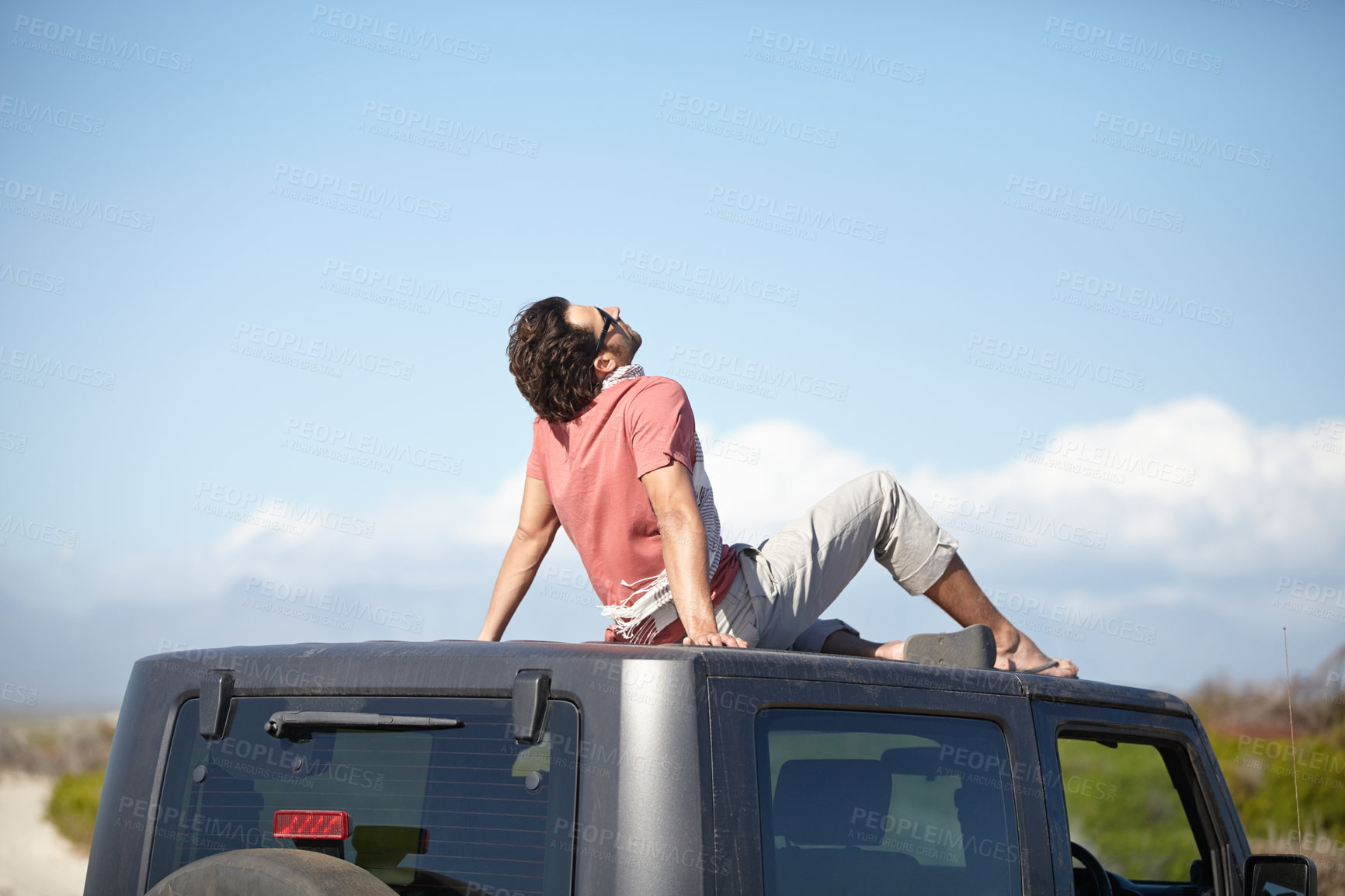 Buy stock photo Travel, man and sitting on van roof for scenery, nature and fresh air on adventure or vacation in South Africa. Person, tourist or traveler on rooftop of car with sunglasses for view or road trip