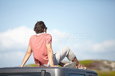 Buy stock photo Back, man and travel on car roof for scenery, nature and fresh air on adventure or vacation in South Africa. Person, tourist or traveler on rooftop of van with sunglasses for view or journey or rear