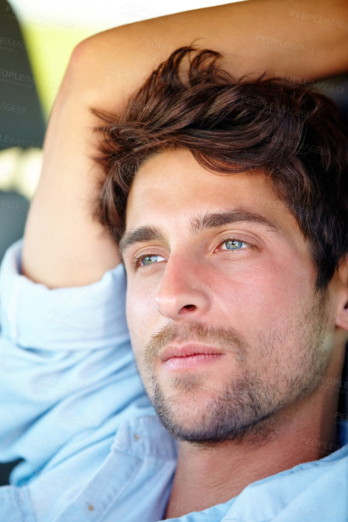 Buy stock photo A young man enjoying his vacation road trip with a smile