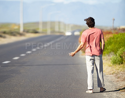 Buy stock photo Man, highway and hiking for getaway outside for road trip, vacation and adventure for travel. Male person, walking and vehicle problems outside for vacation, thumbs up and long journey on roadside.