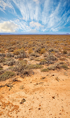 Buy stock photo Landscape of arid and barren highland in Savanna Desert in rural South Africa with copyspace. Dry, empty, remote land against blue sky. Global warming and climate change in drought environment