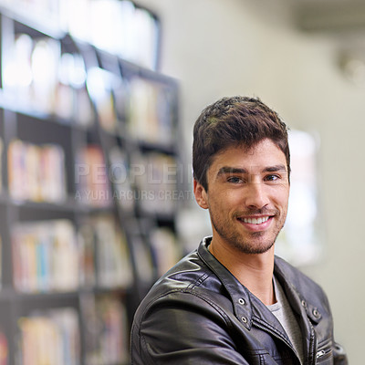 Buy stock photo Portrait of a handsome male student in a university library