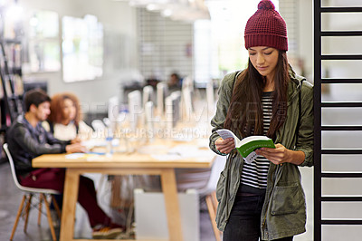 Buy stock photo Woman, student in library reading book and study for exam or research for project on university campus. Education, learning and academic development with female person holding textbook for knowledge