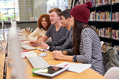 Buy stock photo Shot of students working on computers in a university library