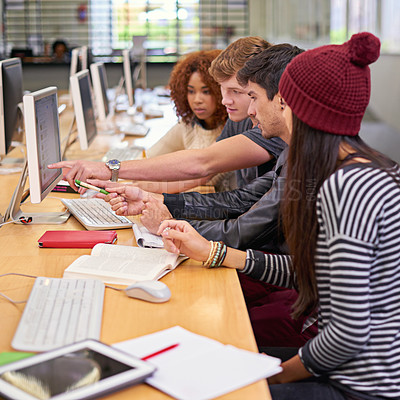 Buy stock photo Shot of students working on computers in a university library