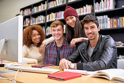 Buy stock photo Portrait of a group of students working together at a computer in a university library