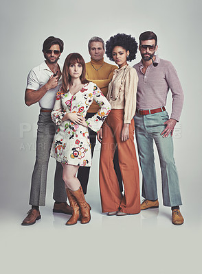Buy stock photo A studio shot of a group of people standing together while clad in retro 70s wear