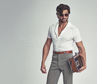 Buy stock photo Man, fashion and retro with radio in studio, grey background and smart clothes with elegant style. Trendsetter, vintage and fashionable with old school with pipe, smoking and classy with confidence. 