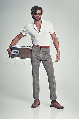 Buy stock photo Men, fashion and confident with radio on retro in studio, grey background and smart clothes with elegant style. Trends, vintage and fashionable with old school in Italian look and classic outfit.