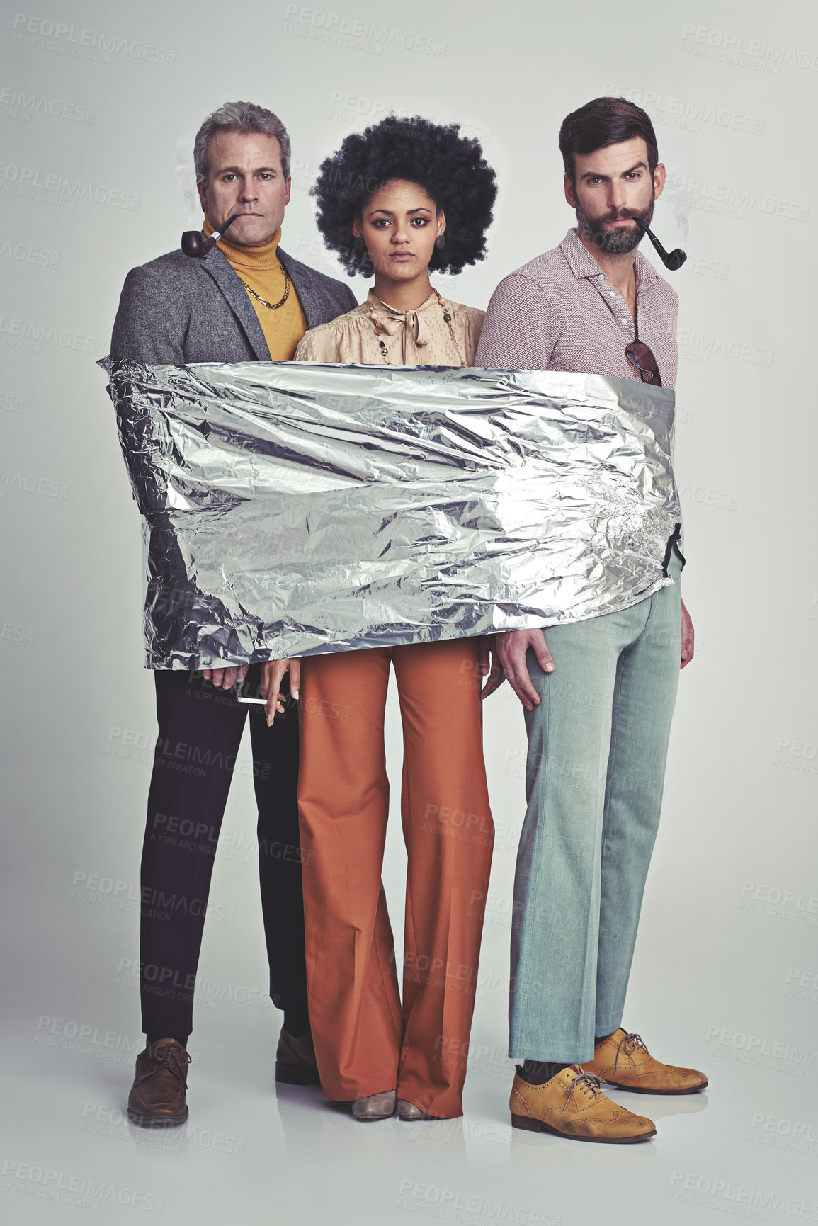 Buy stock photo Three hippies wrapped in tin foil