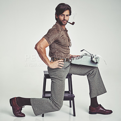 Buy stock photo Studio shot of a 70's style businessman sitting on a stool using a typewriter