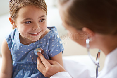 Buy stock photo Cropped shot of an adorable young girl with her pediatrician