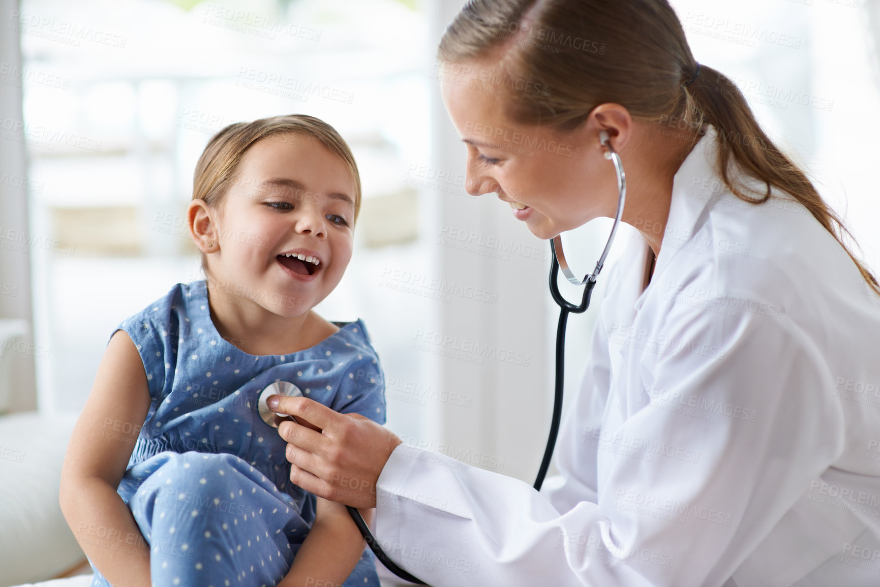 Buy stock photo Child, happy pediatrician and stethoscope for healthcare consulting, check lungs and listening to heartbeat. Woman, medical doctor and girl kid in clinic for chest assessment, analysis and checkup