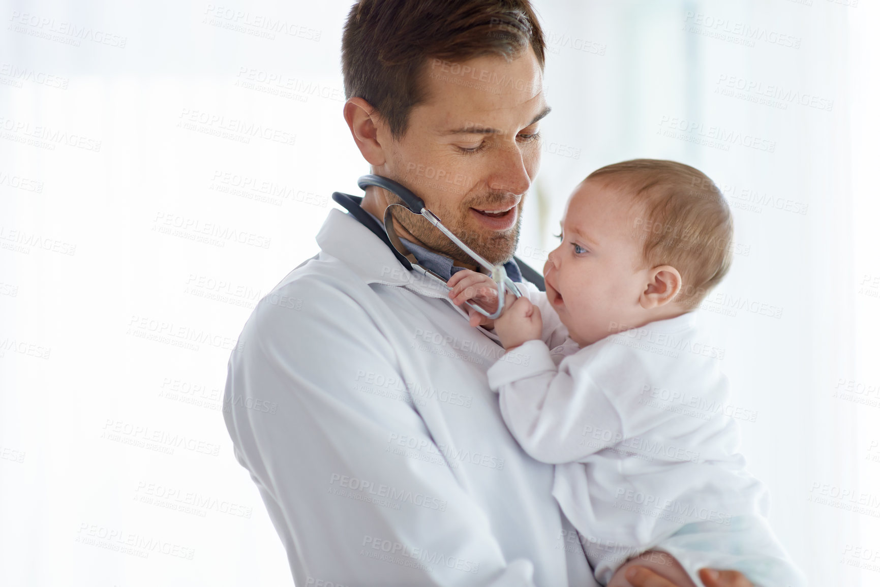 Buy stock photo Man, pediatrician and baby playing with stethoscope for medical assessment, support or healthcare of children. Cute newborn, doctor and pediatrics in clinic, kids hospital and trust of expert mockup