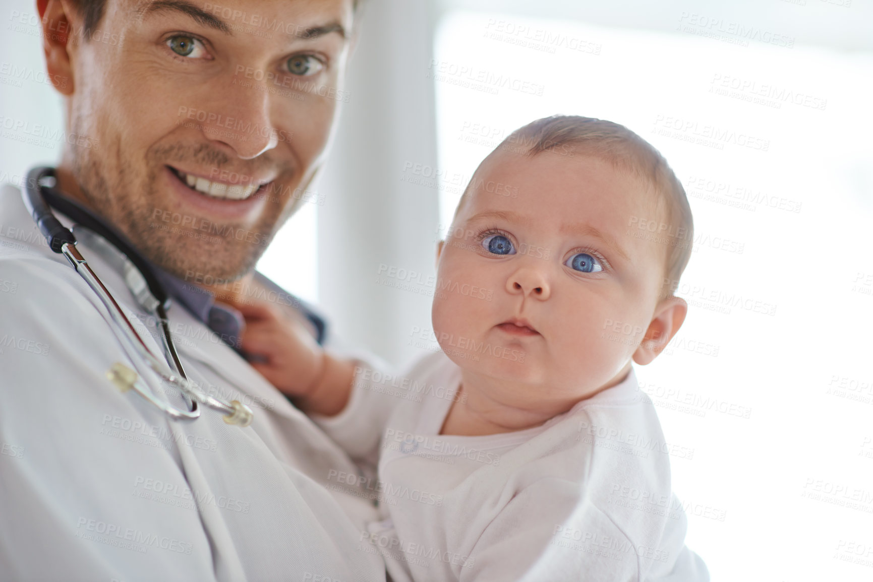 Buy stock photo Portrait, pediatrician and holding baby in clinic assessment, medical support and growth. Newborn kids, happy man and pediatrics doctor in hospital for healthcare, consulting and wellness of children